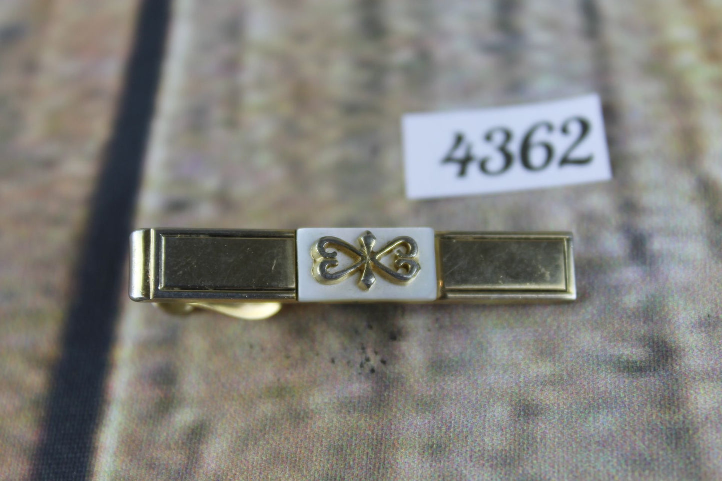 Vintage SWANK gold metal white lucite scrollwork design tie clip