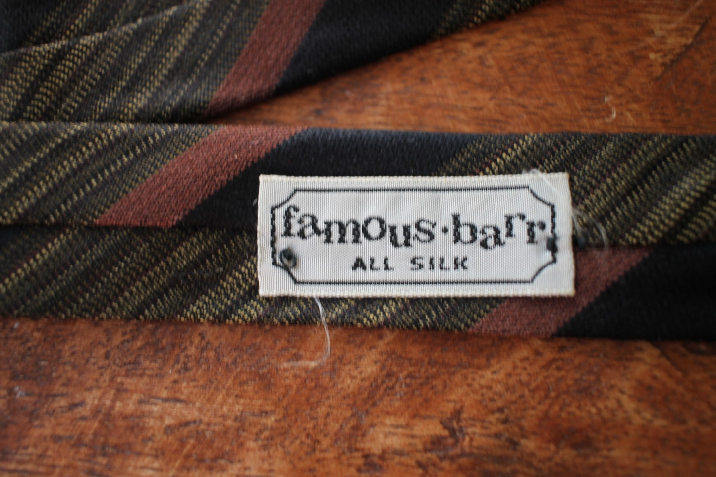 Vintage Famous Barr all silk brown gold green striped pattern skinny tie