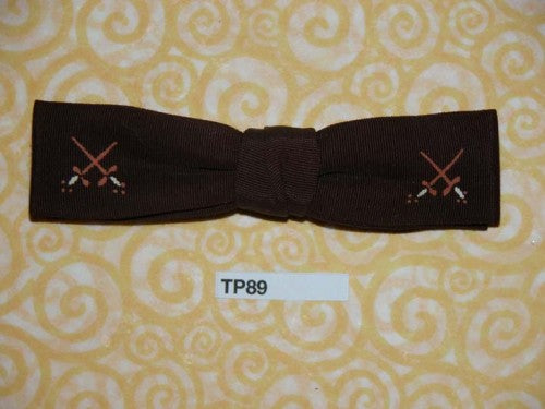 Vintage small narrow brown crossed sword motif clip on bow tie