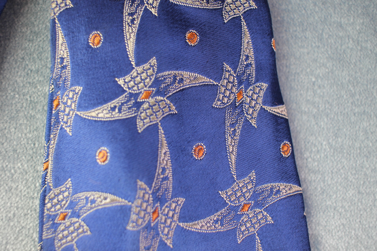 Vintage Goodcraft Cravats blue silver orange recurring pattern swing tie