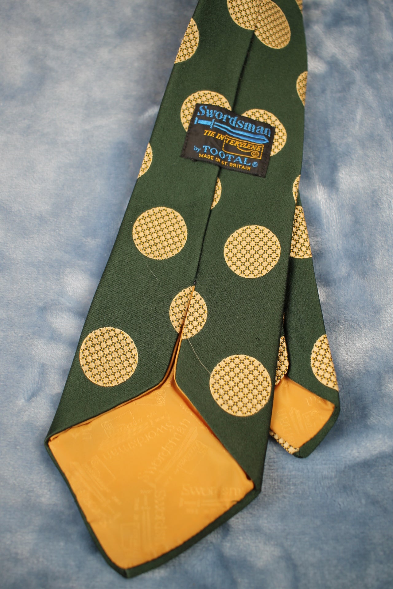 Vintage Tootal 1960s dark green gold circles pattern kipper tie